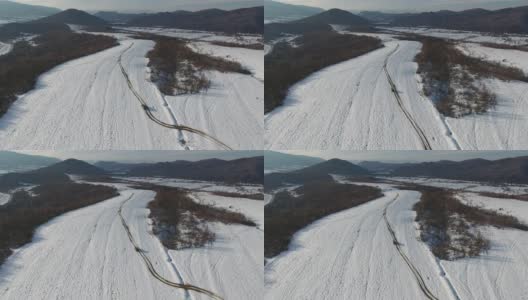航空摄影的越野车在冬季喀尔巴阡高清在线视频素材下载