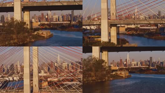 清晨从科修斯科大桥俯瞰曼哈顿中城的天际线。带上升摄像机运动的航拍视频。高清在线视频素材下载