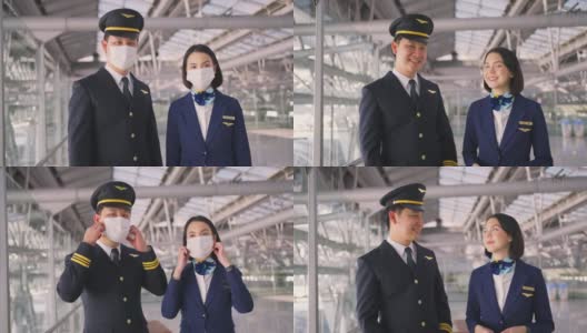 新冠肺炎疫情期间，飞行员和空乘人员戴口罩走在机场航站楼走向飞机，以预防新冠肺炎感染。航空运输的新常态生活理念。高清在线视频素材下载