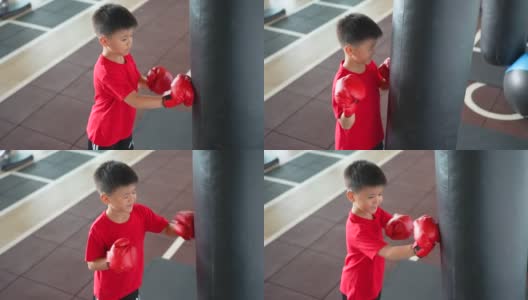 亚洲男孩微笑着在健身房练拳击、骑自行车高清在线视频素材下载