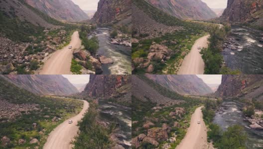 一辆白色的越野车正沿着巨大的卡图-亚历克峡谷(Katu-Yaryk canyon Chulyshman Valley)的一条空旷的乡村公路行驶。阿尔泰、西伯利亚,俄罗斯。人们在泥土上旅行高清在线视频素材下载