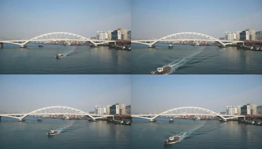 在釜山的釜山大公大桥下航行的船只。高清在线视频素材下载
