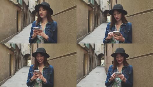 年轻的千禧一代女性在手机上阅读信息的实时视频高清在线视频素材下载