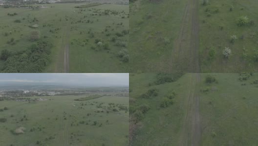 飞过乡间小路，照相机升到地平线上。该视频是在Mavik Air上拍摄的100mvps 4k高清在线视频素材下载