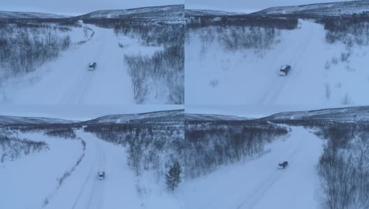 空中汽车在雪道上行驶，穿过令人惊叹的山区冬季景观高清在线视频素材下载