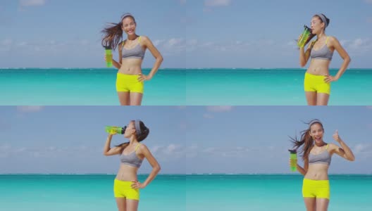 运动员在户外沙滩上进行健身跑步后饮用瓶装水。口渴的女人喝着冷饮，在户外剧烈运动后满头大汗竖起大拇指。缓慢的运动。高清在线视频素材下载