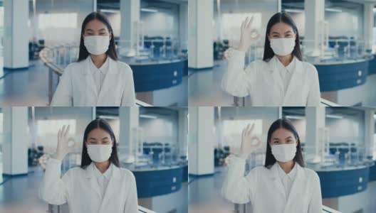 戴着口罩的韩国实验室女工作人员在室内做手势示意可以高清在线视频素材下载