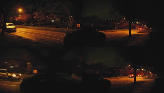 城市里的汽车在晚上从房子旁边驶过高清在线视频素材下载