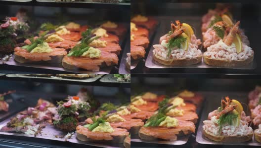 丹麦，斯堪的纳维亚式开放式三明治。美味的黑麦面包与不同种类的肉，海鲜，蔬菜浇头拍摄在慢镜头高清在线视频素材下载