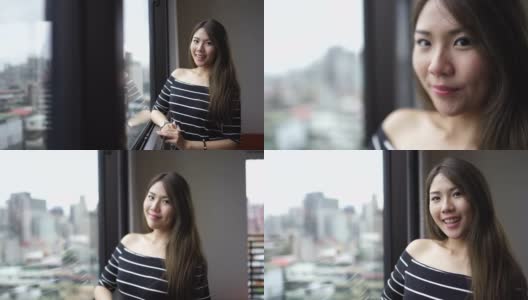 有吸引力的台湾女人的肖像靠近窗户高清在线视频素材下载