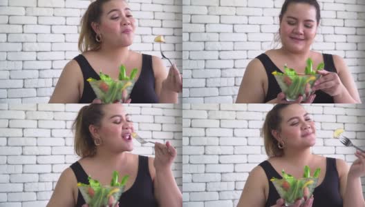 泰国身材高大的女人吃蔬菜沙拉等健康食品高清在线视频素材下载