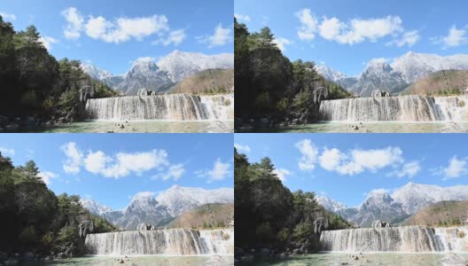 中国云南省丽江玉龙山白水河上的白瀑布高清在线视频素材下载