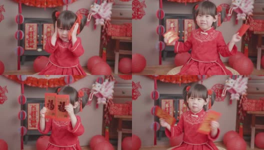 蹒跚学步的小女孩穿着传统服装庆祝中国新年高清在线视频素材下载