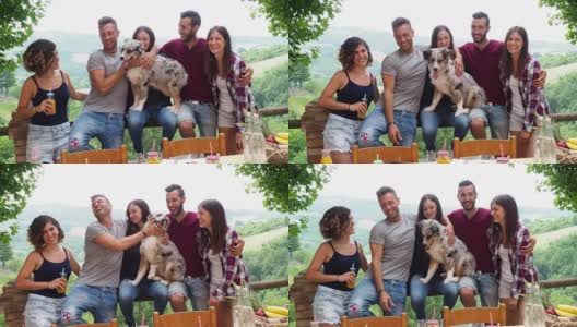 一群朋友和一只有趣的狗一起在乡下度假高清在线视频素材下载