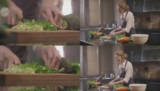 美丽的女人在厨房切新鲜的蔬菜。用红色史诗电影摄像机拍摄。高清在线视频素材下载