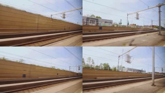 从窗口看火车沿着铁路站台移动。火车上的乡村旅行高清在线视频素材下载
