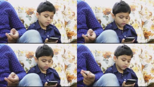 儿童和科技-年轻的孩子使用现代智能手机高清在线视频素材下载