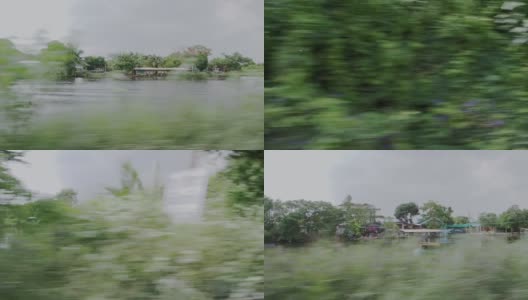 超速行驶的汽车穿过绿树和河边的窗户，模糊了运动的视线高清在线视频素材下载