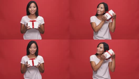 很高兴好奇的亚洲女人在t恤手持礼盒高清在线视频素材下载