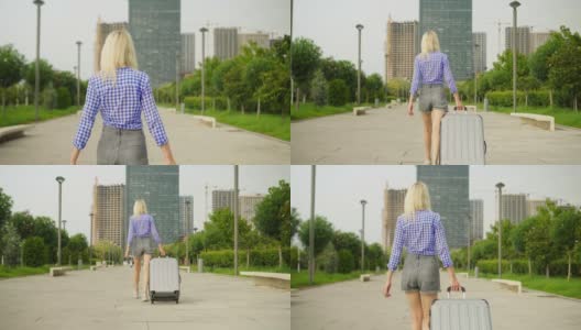 一位女游客的背影，她走过南方的城市高清在线视频素材下载