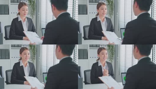 亚洲女性在办公室面试后与人事经理握手。漂亮漂亮的女员工在求职后与人力资源经理、商人握手高清在线视频素材下载
