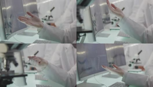 非洲和亚洲的科学家正在研究DNA样本。电脑屏幕和显微镜。靠近手边高清在线视频素材下载