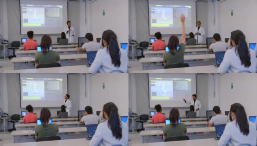 男机器人老师在课堂上讲解，同时有学生举手提问高清在线视频素材下载