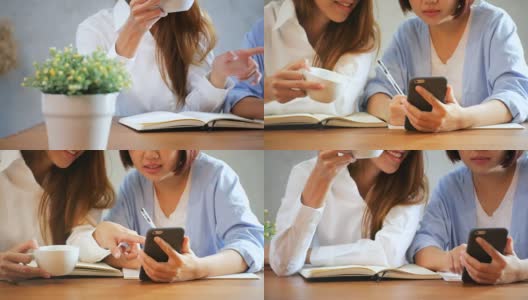 商务女性使用手机，在木桌上写报告。用手机和咖啡的亚洲女性。在咖啡店工作的自由职业者。在外工作的生活方式。高清在线视频素材下载
