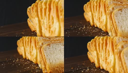黑色背景上的切片面包高清在线视频素材下载