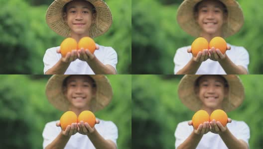 农民手上挂着橘子，脸上挂着笑容高清在线视频素材下载