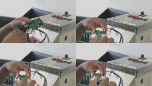 工程师用烙铁修理印刷电路板高清在线视频素材下载