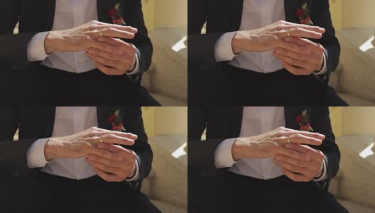 特写新郎的手与戒指和袖扣高清在线视频素材下载
