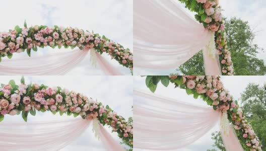 婚礼花拱装饰。婚礼拱门上装饰着鲜花高清在线视频素材下载