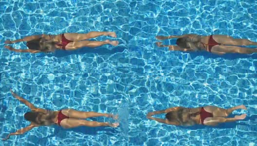 俯视图，不认识的年轻女子游泳在游泳池的水和出现在阳光明媚的一天的表面。美丽的女孩穿着红色比基尼漂浮在盆地的酒店。假期或假日概念。高清在线视频素材下载