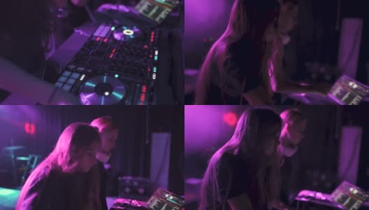 夜店里，两个年轻漂亮的女DJ在调音台播放音乐高清在线视频素材下载