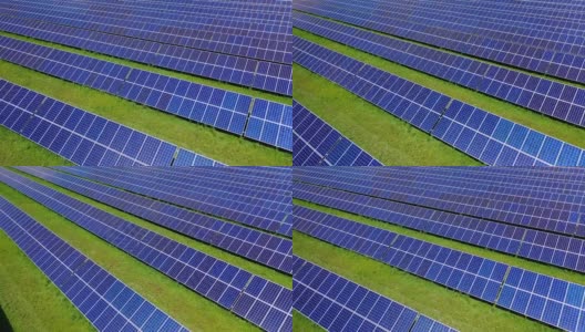 太阳能电池板领域。蓝色太阳能电池板提供清洁能源。绿色田野上一排排的阳光电池。可再生替代能源概念。未来的技术。高清在线视频素材下载