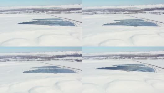 空中视角太阳能电池板农场绿色能源在冬季雪晴天高清在线视频素材下载