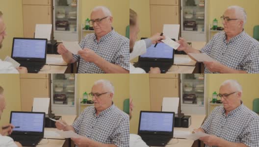 一位男性神经学家为一位老年病人开了处方高清在线视频素材下载
