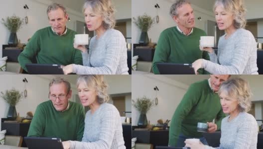 退休老年夫妇在家使用数字平板电脑在线购买产品或服务高清在线视频素材下载
