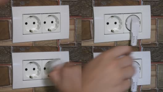 特写的欧洲墙壁电源插座被插入和拔出由一个女人的手。高清在线视频素材下载