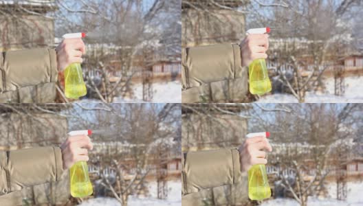 在冬天用喷雾瓶手动喷洒高清在线视频素材下载