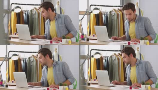 男学生或企业主在时尚工作使用笔记本电脑在工作室高清在线视频素材下载
