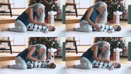 慈爱的祖母在圣诞节期间照顾她的孙女高清在线视频素材下载