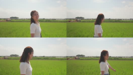 一名日本女子在夏天走在稻田里高清在线视频素材下载