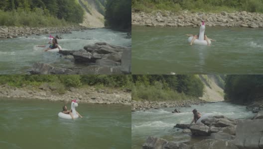 开朗迷人的亚洲女子泳装乐趣漂浮在大充气环在山间河流高清在线视频素材下载
