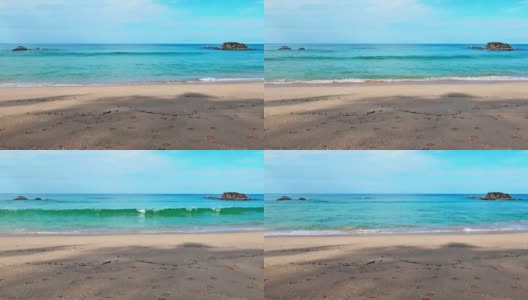 热带海滩狗爪或脚印与海水和海浪高清在线视频素材下载