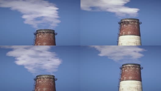 垂直视频的烟囱和烟雾的天空背景高清在线视频素材下载
