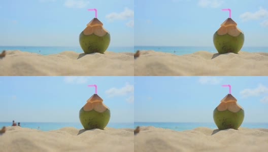 沙滩上用吸管喝椰子汁高清在线视频素材下载