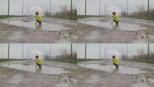 一个小男孩在雨中高清在线视频素材下载