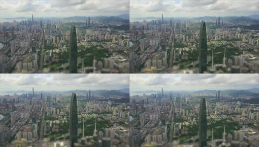 阳光明媚的一天，深圳城市景观著名建筑的空中全景4k倾斜移位中国高清在线视频素材下载